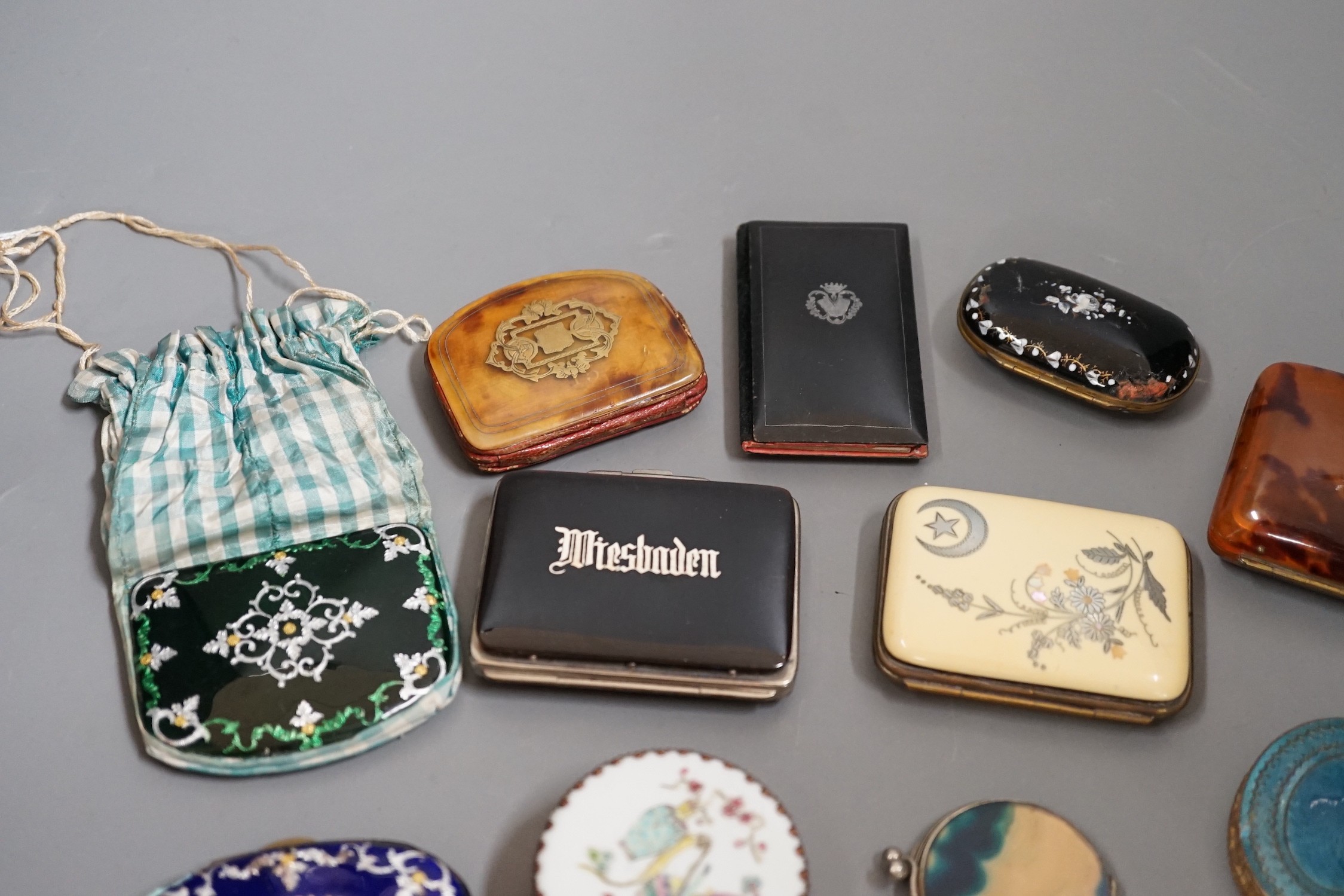 A mixed collection of enamel, tortoiseshell and other purses, a Chinese porcelain box and enamel topped box